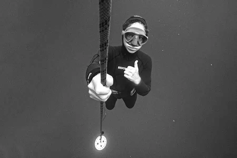 Freediving Coachimg session in Gozo with a freediver giving a thumbs up ascending the line