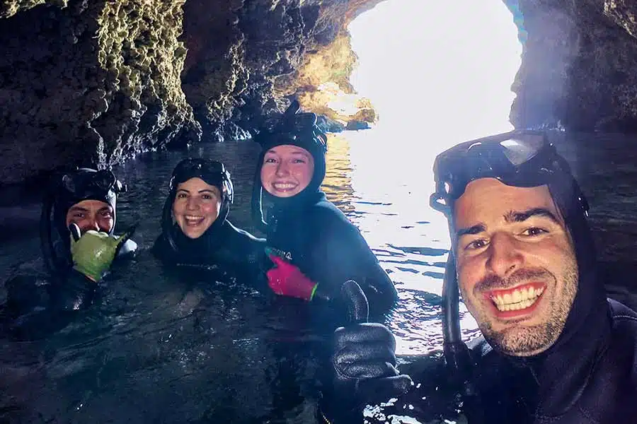 Cave Freedivers in malta and Gozo selfie of smiley freedivers inside a cave