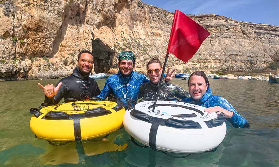 Group of freedivers posing close to freediving buoys after a static apnea course in Gozo